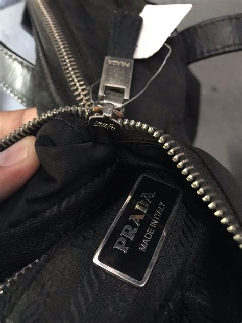 lampo zippers prada|Prada bag inside.